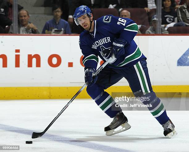 Mikael Samuelsson of the Vancouver Canucks skates up ice with the puck in Game Three of the Western Conference Semifinals against the Chicago...