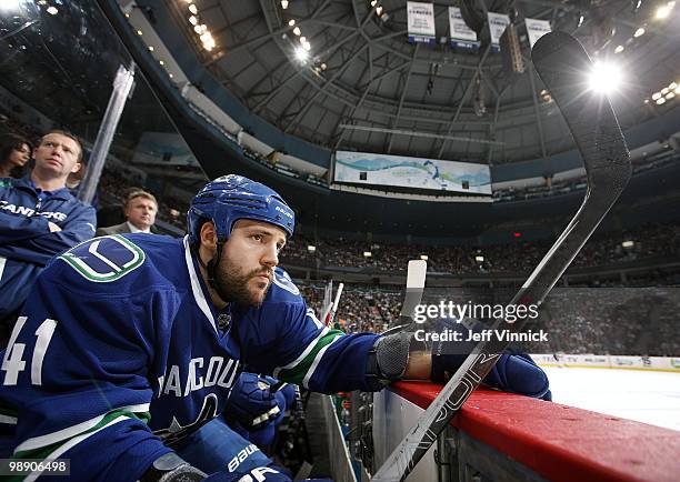 Andrew Alberts of the Vancouver Canucks looks on from the bench in Game Three of the Western Conference Semifinals against the Chicago Blackhawks...