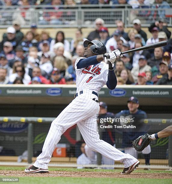 Orlando Hudson of the Minnesota Twins follows through on a hit during a game against the Detroit Tigers at Target Field on May 5, 2010 in...