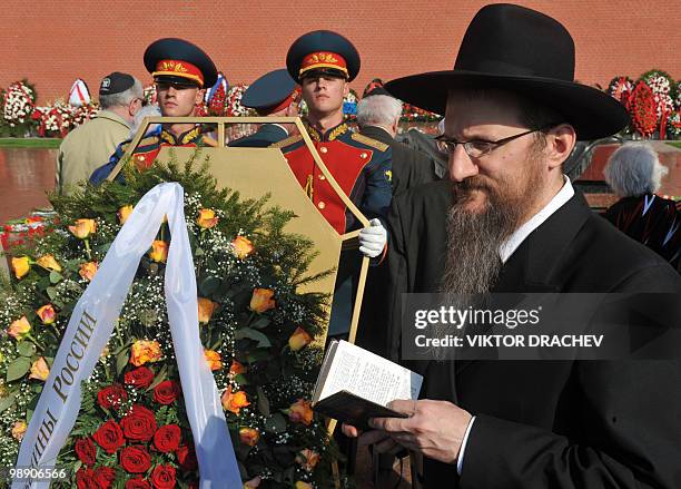 Russia's chief Rabbi Berl Lazar reads a prayer at the Tomb of the Unknown Soldier in central Moscow on May 7, 2010 during a wreath-laying ceremony...