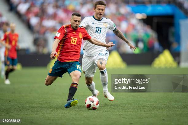 Jordi Alba of Spain and Fedor Smolov of Russia battle for the ball during the 2018 FIFA World Cup Russia Round of 16 match between Spain and Russia...