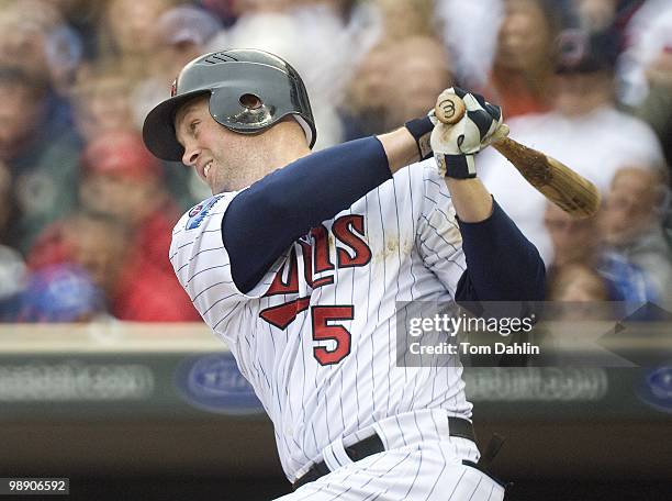 Michael Cuddyer of the Minnesota Twins follows through on a swing during a game against the Detroit Tigers at Target Field on May 5, 2010 in...
