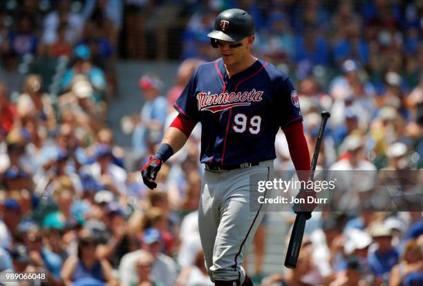 Logan Morrison of the Minnesota Twins reacts after striking out against the Chicago Cubs during the first inning at Wrigley Field on July 1, 2018 in...