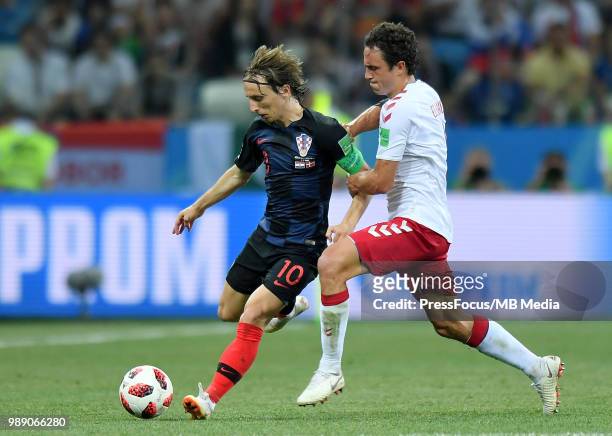 Thomas Delaney of Denmark competes with Luka Modric of Croatia during the 2018 FIFA World Cup Russia Round of 16 match between Croatia and Denmark at...