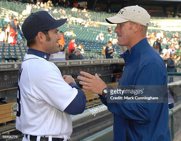 Johnny Damon of the Detroit Tigers talks with former Major Leaguer Lance Niekro before the game against the Minnesota Twins at Comerica Park on April...