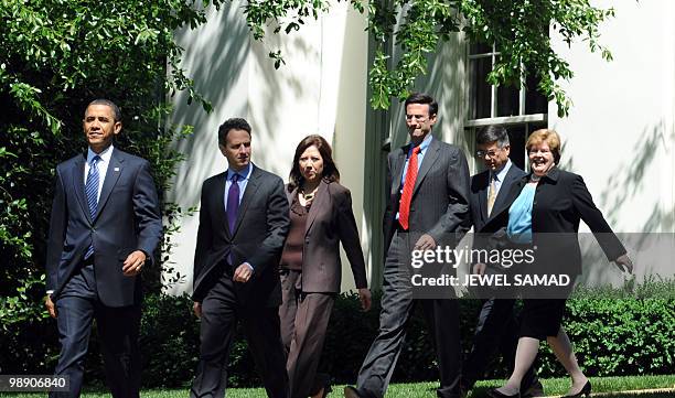 President Barack Obama is followed by US Treasury Secretary Timothy Geithner, Labor Secretary Hilda Solis, Director of the Office of Management and...