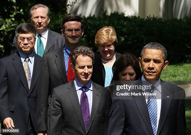 President Barack Obama walks out to speak with by Treasury Secretary Timothy Geithner, Secretary of Labor Hilda Solis, Director of the Office of...