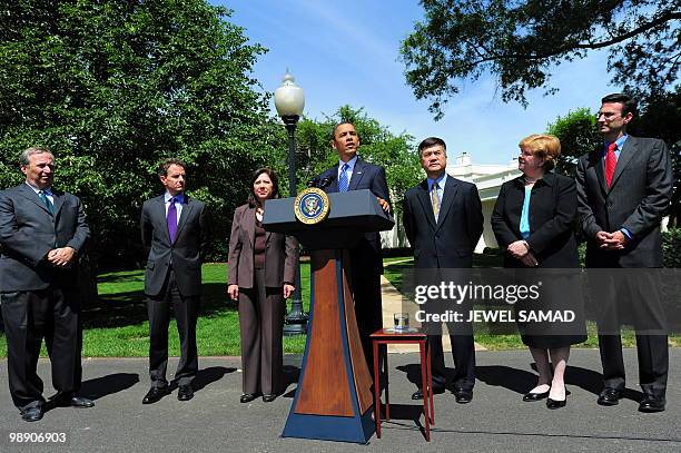 President Barack Obama , accompanied by Director of the National Economic Council Lawrence Summers, US Treasury Secretary Timothy Geithner, Labor...