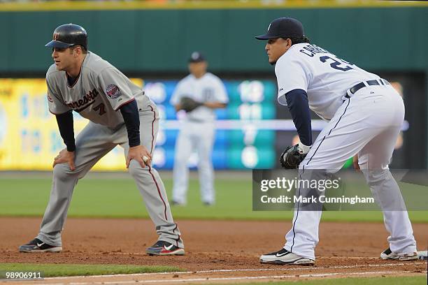 Joe Mauer of the Minnesota Twins leads off first base while Miguel Cabrera of the Detroit Tigers fields during the game at Comerica Park on April 28,...