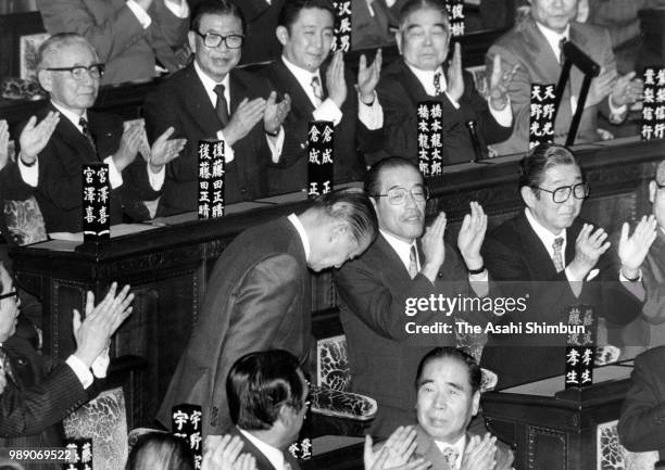 Noboru Takeshita is applauded by fellow lawmakers after elected as new Prime Minister at the Lower House plenary session on November 6, 1987 in...