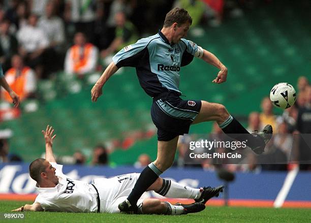 Gudni Bergson of Bolton shoots under pressure from David Healy of Preston during the match between Bolton Wanderers and Preston North End in the...