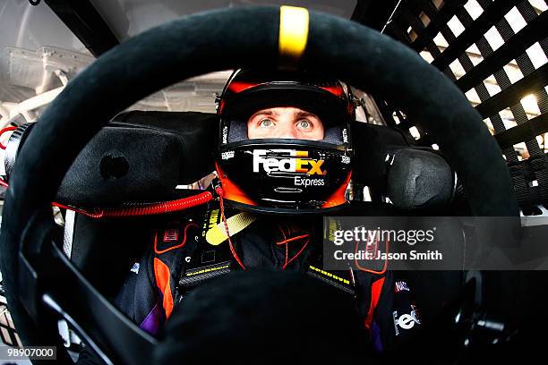 Denny Hamlin, driver of the FedEx Express Toyota, sits in his car during practice for the NASCAR Sprint Cup Series Showtime Southern 500 at...