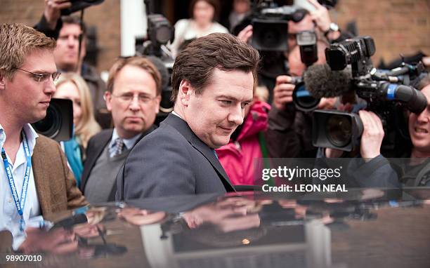 British opposition Conservative part Shadow Chancellor George Osborne leaves the St. Stephen's Club in Westminster, London on May 7, 2010 after...