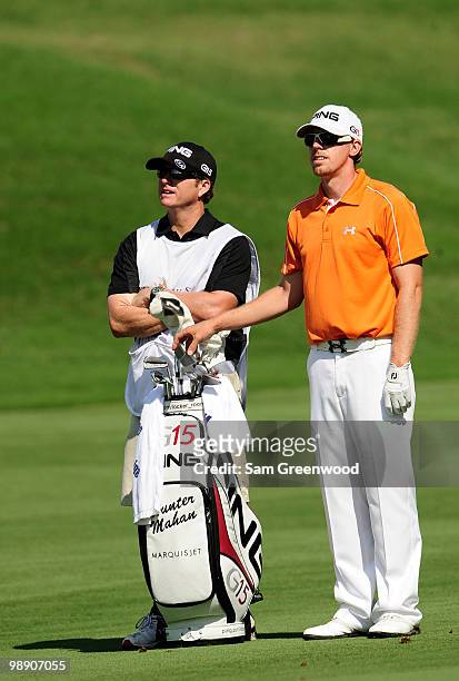 Hunter Mahan and his caddie John Wood wait on the 16th fairway during the second round of THE PLAYERS Championship held at THE PLAYERS Stadium course...