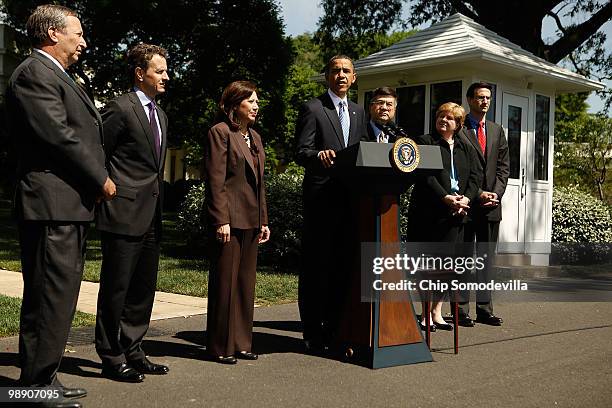 President Barack Obama speaks with members of his economics team National Economic Council Director Lawrence Summers, Treasury Secretary Timothy...