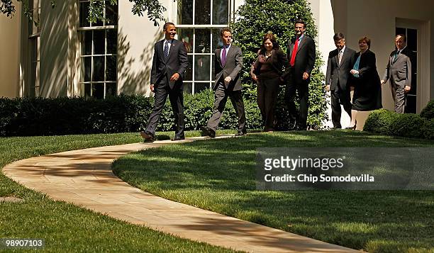 President Barack Obama leads members of his economics team Treasury Secretary Timothy Geithner, Labor Secretary Hilda Solis; Office of Management and...