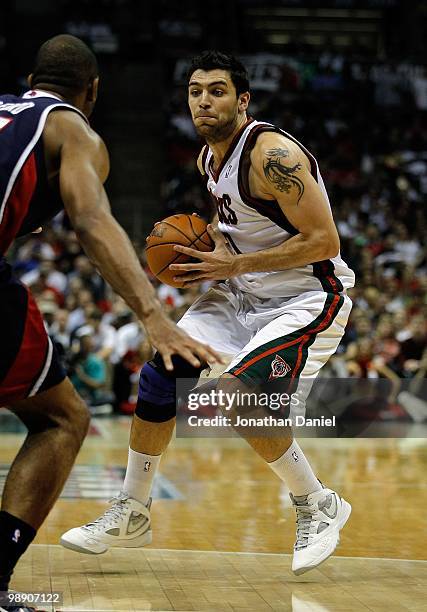 Carlos Delfino of the Milwaukee Bucks looks to pass against the Atlanta Hawks in Game Four of the Eastern Conference Quarterfinals during the 2010...