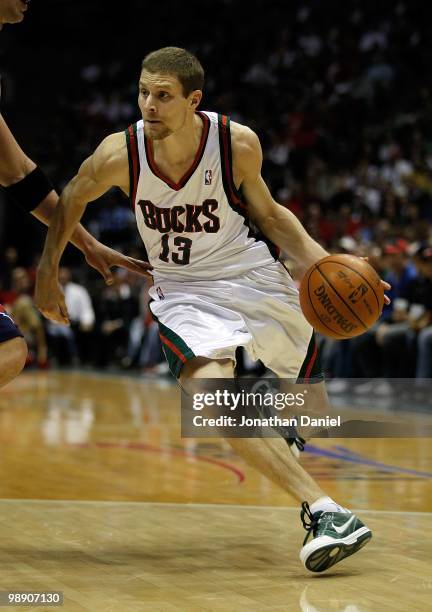 Luke Ridnour of the Milwaukee Buck drives against the Atlanta Hawks in Game Four of the Eastern Conference Quarterfinals during the 2010 NBA Playoffs...