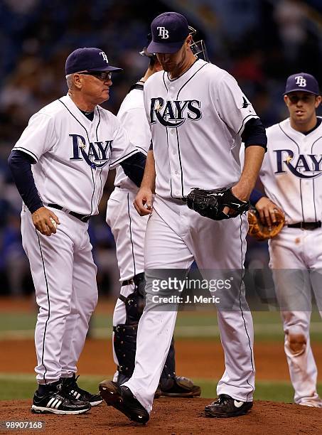 Manager Joe Maddon takes out pitcher Jeff Niemann of the Tampa Bay Rays during the game against the Kansas City Royals at Tropicana Field on April...