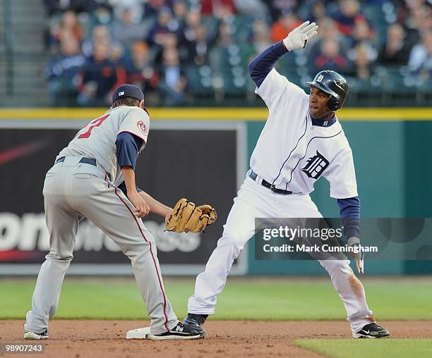 Austin Jackson of the Detroit Tigers is safe at second as J.J. Hardy of the Minnesota Twins applies the tag during the game at Comerica Park on April...