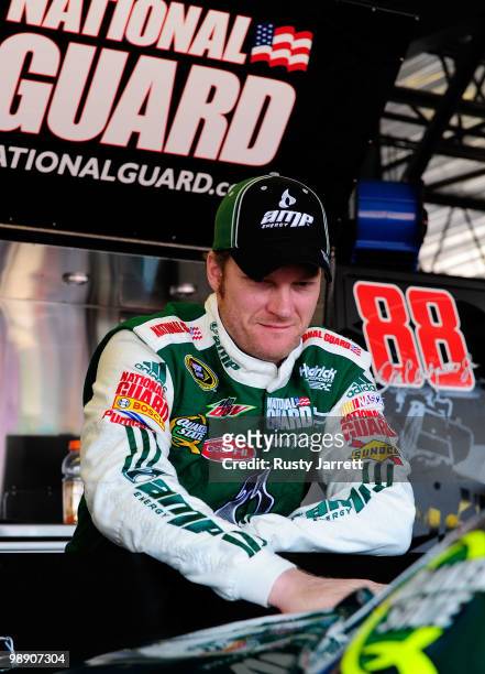Dale Earnhardt Jr., driver of the AMP Energy / National Guard Chevrolet, looks on in the garage during practice for the NASCAR Sprint Cup Series...