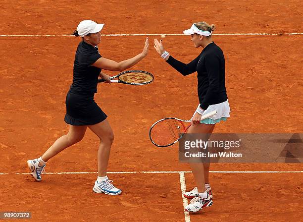 Nadia Petrova of Russia with her team mate Liezel Huber of the USA celebrates a point against Flavia Pennetta of Italy and Gisela Dulko of Argentina...