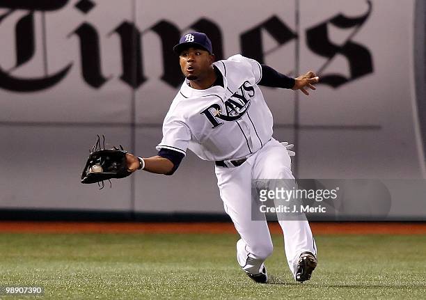 Outfielder Carl Crawford of the Tampa Bay Rays catches a fly ball against the Kansas City Royals during the game at Tropicana Field on April 30, 2010...