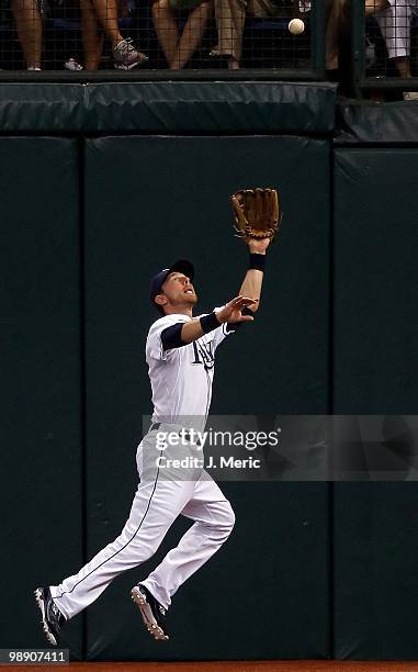 Outfielder Ben Zobrist of the Tampa Bay Rays catches a fly ball against the Kansas City Royals during the game at Tropicana Field on April 30, 2010...