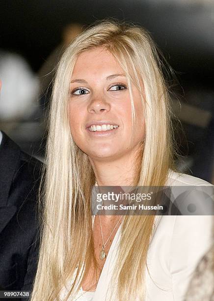 Chelsy Davy watches Prince Harry with his flying badges at the Museum of Army Flying on May 7, 2010 in Middle Wallup, England.