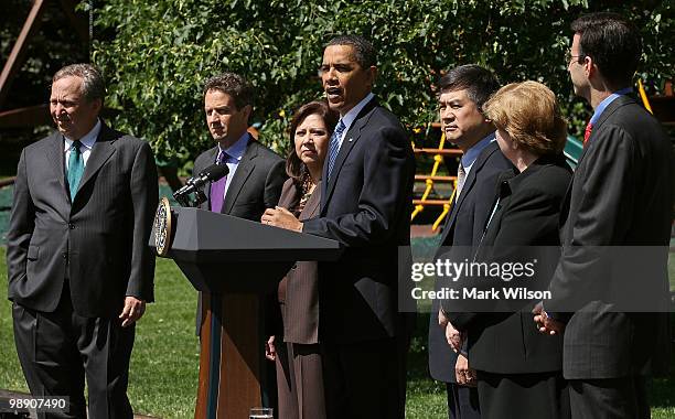 President Barack Obama speaks about jobs while flanked by Director of the National Economic Council Larry Summers , Treasury Secretary Timothy...