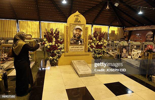 Lebanese Shiite woman visits the grave of slain Hezbollah commander Imad Mughnieh in southern Beirut on February 16, 2010. Hezbollah is commemorating...