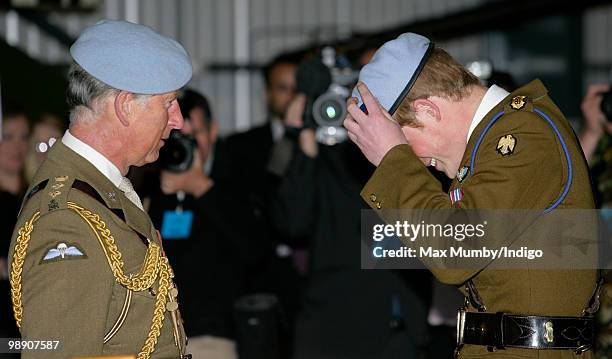 Prince Charles, The Prince of Wales, Colonel in Chief of the Army Air Corps presents HRH Prince Harry with his Army Air Corps blue beret at the Army...