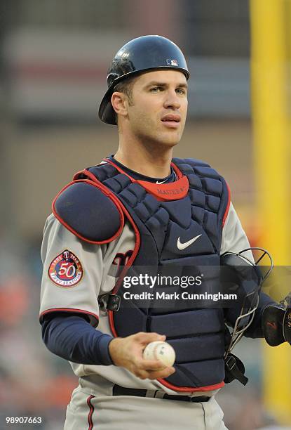 Joe Mauer of the Minnesota Twins looks on against the Detroit Tigers during the game at Comerica Park on April 28, 2010 in Detroit, Michigan. The...