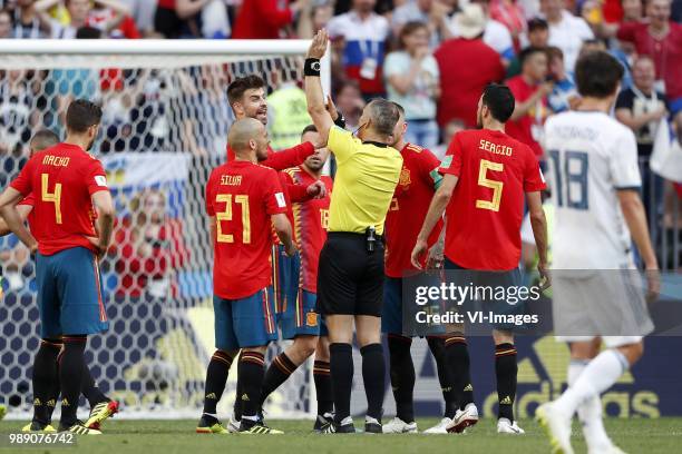 Nacho Fernandez of Spain, David Silva of Spain, Gerard Pique of Spain, referee Bjorn Kuipers, Sergio Ramos of Spain, Sergio Busquets of Spain during...