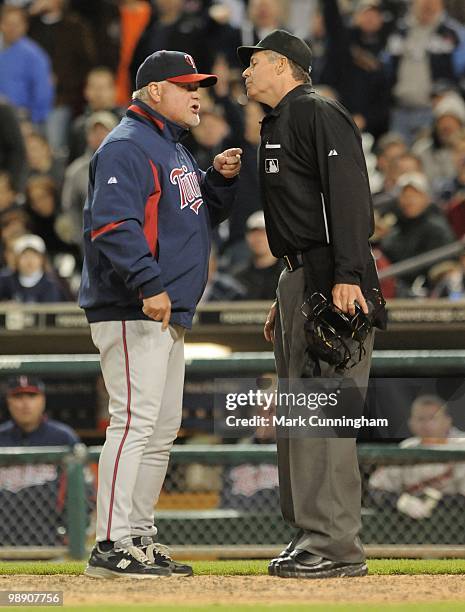 Manager Ron Gardenhire of the Minnesota Twins argues a call with home plate umpire Gary Darling during the game against the Detroit Tigers at...