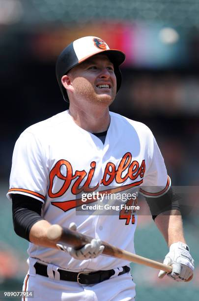 Mark Trumbo of the Baltimore Orioles reacts after striking out in the second inning against the Los Angeles Angels at Oriole Park at Camden Yards on...