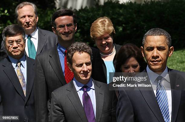 President Barack Obama walks out to speak with by Treasury Secretary Timothy Geithner, Secretary of Labor Hilda Solis, Director of the Office of...