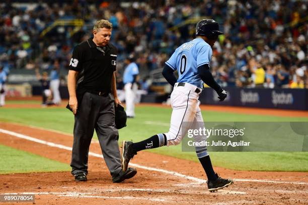 Mallex Smith of the Tampa Bay Rays steps on home plate after hitting a home run in the eighth inning against the Houston Astros on July 1, 2018 at...