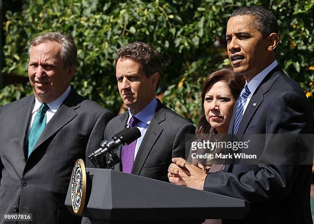 President Barack Obama speaks about jobs while flanked by Secretary of Labor Hilda Solis, Treasury Secretary Timothy Geithner, and Director of the...
