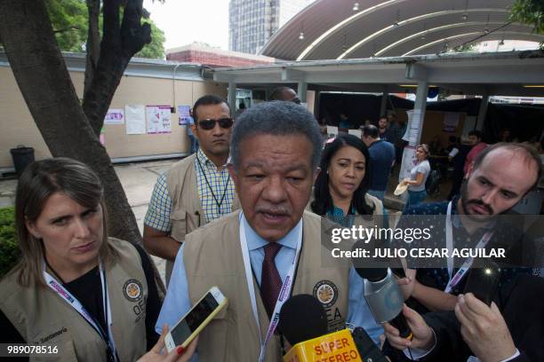 The head of the Organization of American States electoral observation mission and Dominican former president Leonel Fernandez speaks during a press...