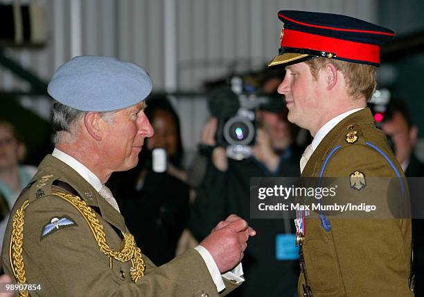 Prince Charles, The Prince of Wales, Colonel in Chief of the Army Air Corps presents HRH Prince Harry with his wings at the Army Air Corps pilots...