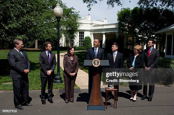 President Barack Obama, center, speaks during a news conference at the White House with Lawrence "Larry" Summers, director of the U.S. National...