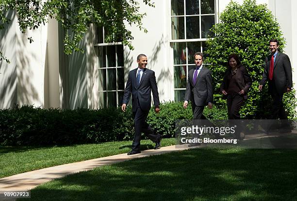 President Barack Obama, from left, walks out of the White House with Timothy Geithner, U.S. Treasury secretary, Hilda Solis, U.S. Secretary of labor,...