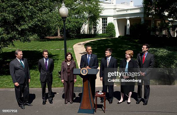 President Barack Obama, center, speaks during a news conference at the White House with Lawrence "Larry" Summers, director of the U.S. National...