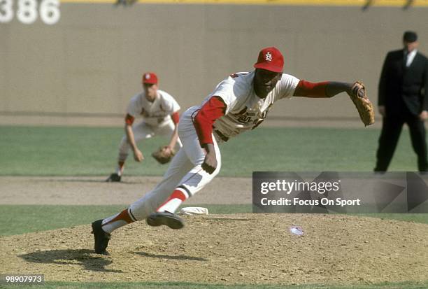 S: Pitcher Bob Gibson of the St. Louis Cardinals follows through on a pitch circa late 1960's during a Major League Baseball game at Busch Stadium in...