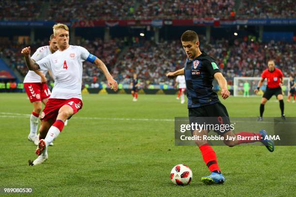 Andrej Kramaric of Croatia competes with Simon Kjaer of Denmark during the 2018 FIFA World Cup Russia Round of 16 match between Croatia and Denmark...