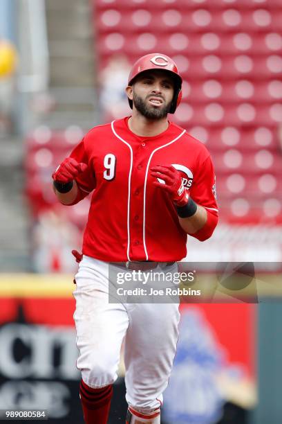 Jose Peraza of the Cincinnati Reds reacts after hitting a grand slam home run in the sixth inning against the Milwaukee Brewers at Great American...