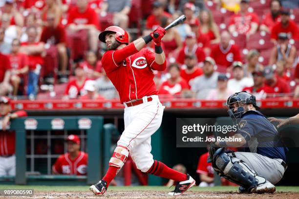 Jose Peraza of the Cincinnati Reds hits a grand slam home run in the sixth inning against the Milwaukee Brewers at Great American Ball Park on July...