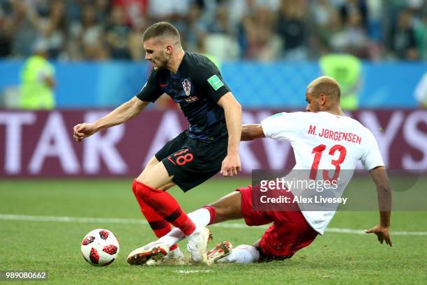 Mathias Jorgensen of Denmark fouls Ante Rebic of Croatia to give Croatia a penalty during the 2018 FIFA World Cup Russia Round of 16 match between...
