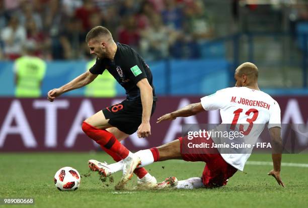 Mathias Jorgensen of Denmark fouls Ante Rebic of Croatia to give Croatia a penalty during the 2018 FIFA World Cup Russia Round of 16 match between...